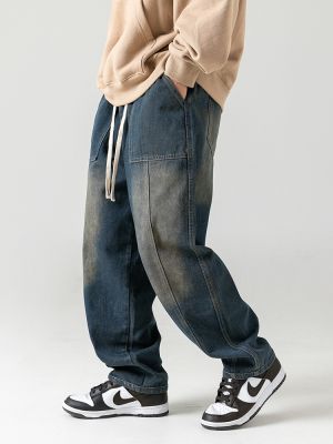 Jeans baggy délavé pour homme avec empiècements poches et taille élastique à cordon