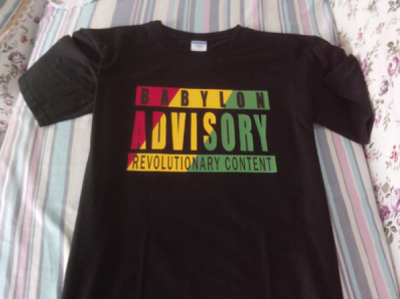 T-shirt Babylon Advisory Revolutionay Content Vert Jaune Reggae Rasta