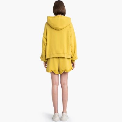 Veste à capuche jaune distressed trouée pour femme manches longues